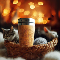 Bamboo Travel Mug with Engraved Amanita  Mushrooms design in the basket with cat and wool ball warm ambiance light