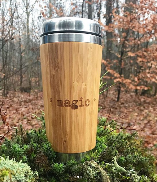 Bamboo Travel Mug With engraved text MAGIC on it in forest moss